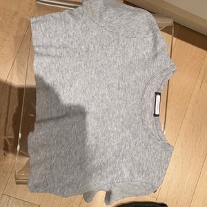 Brandy Melville cropped grey T-shirt.